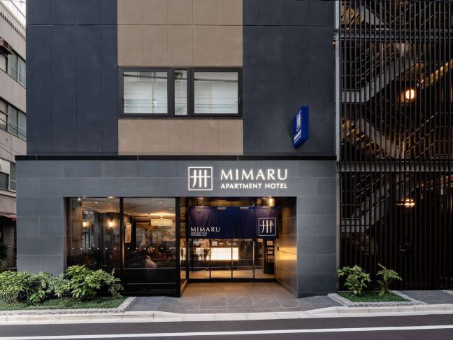Entrance exterior of MIMARU Tokyo GINZA EAST. An Apartment Hotel in the Ginza area of Tokyo with full kitchens in every room and on-site coin-operated laundry. A popular long-term stay hotel for travelers focused on shopping and dining, within walking distance of Yurakucho and Tsukiji